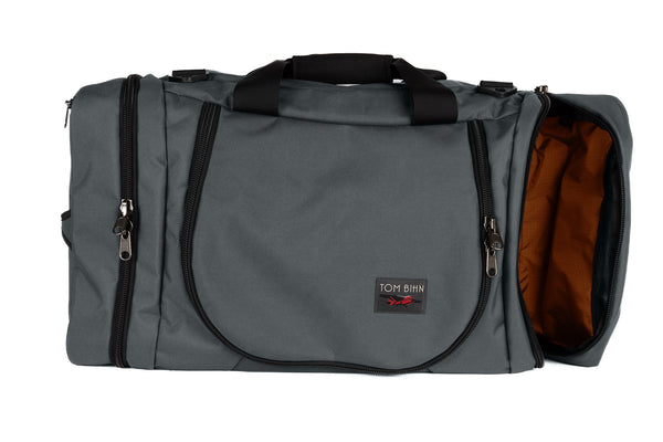 A Nebulous Grey (medium grey) Ballistic Aeronaut 45 with the end pocket open showing the Persimmon (orange) Cerylon.